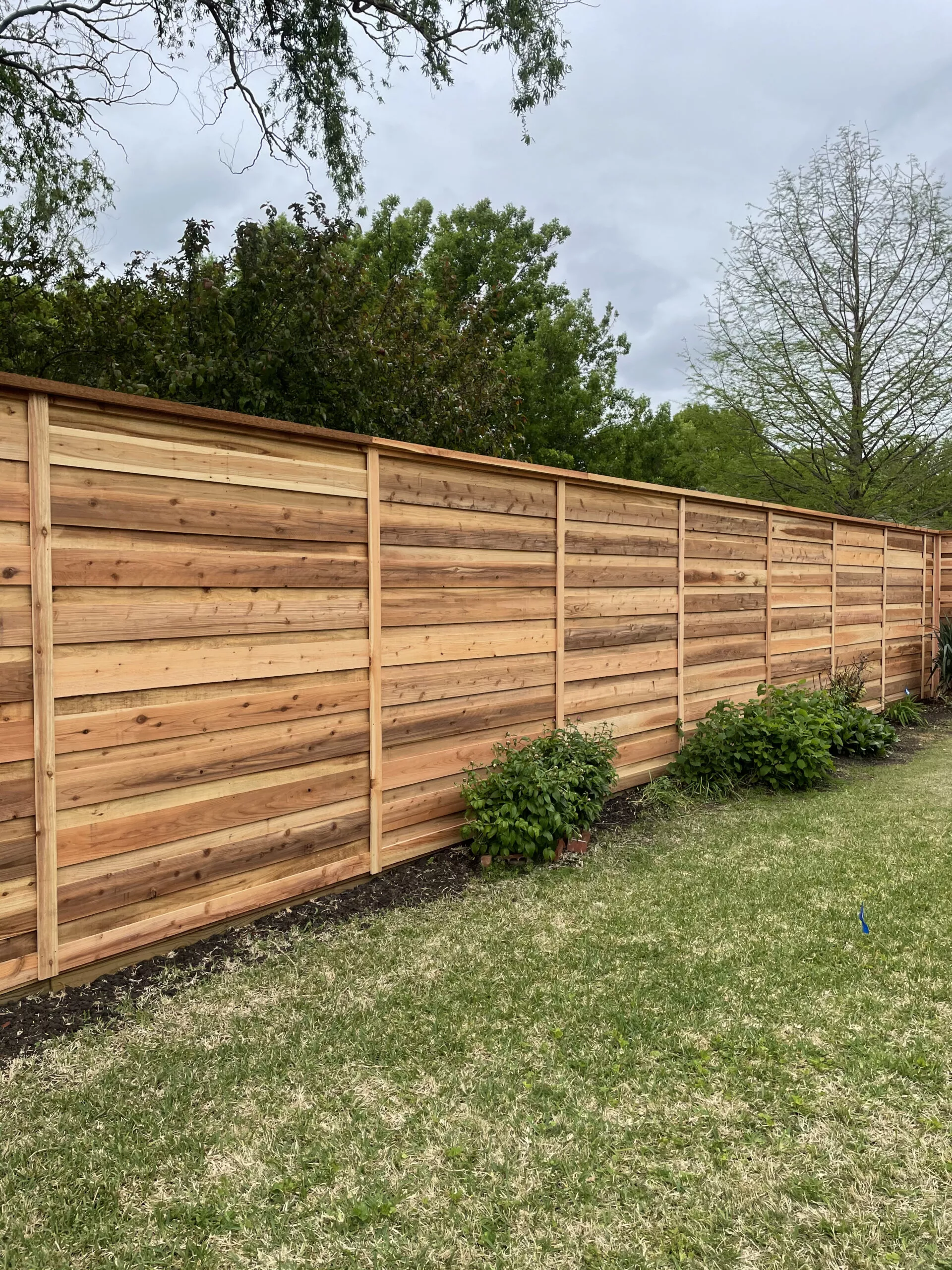 Horizontal Cedar Board on Board Fence.